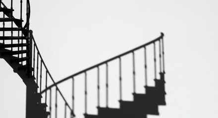 Monochrome spiral staircase against sky