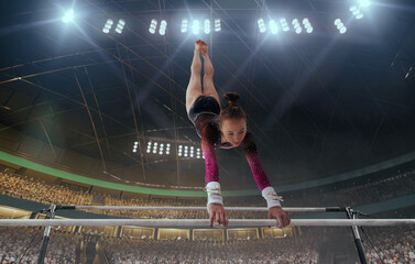 A gymnast performs a difficult trick on a horizontal bar.