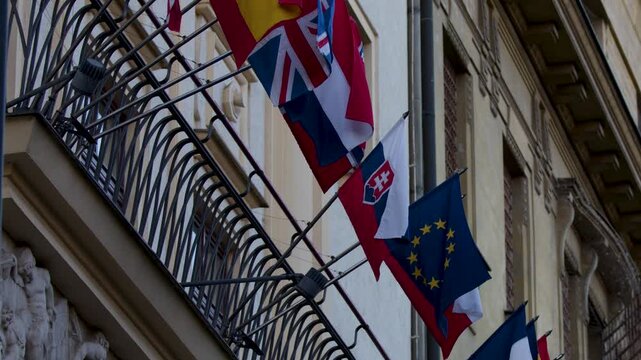 International Flags Waving on Embassy Building in Prague