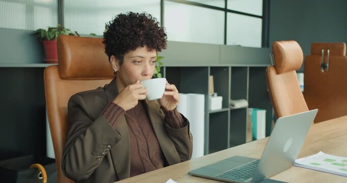 Business professional contemplating strategies while sipping coffee calmly