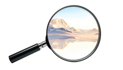 A magnifying glass reveals a scenic winter landscape. Snowy mountains are reflected in a tranquil lake under a bright, clear sky