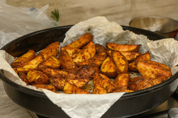 Crispy Baked Potato Wedges with Fresh Rosemary Garnish