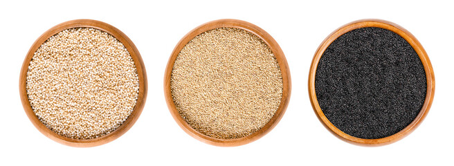 Amaranth grain, in wooden bowls. From left to right popped, white, and black amaranth. Highly nutritious, tiny, gluten-free seeds from the plant Amaranthus, a pseudocereal, used like grain. Photo