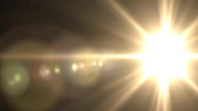 Blinding golden light erupts from darkness