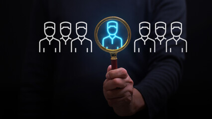 Human hand selecting candidate for HR process optimization and recruitment success