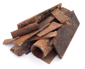 Pile of rusty metal scrap and pipes isolated on white