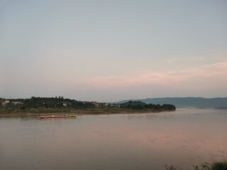 Mekhong river view with slow boat on background