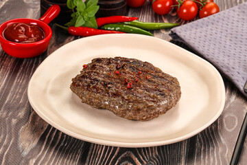 Grilled beef burger cutlet with sauce