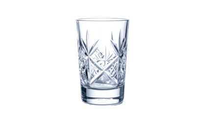 A close-up shot of a decorative, empty drinking glass with intricate cut crystal patterns. The glass sits on a black background