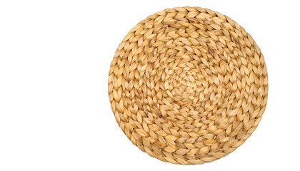 A close-up view presents a round woven object. Its intricate texture and spiraling pattern, set against black, create a simple, yet engaging composition