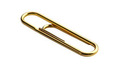 A close-up view presents a gleaming, golden metal object, shaped as a simple fastener. Its curved form contrasts sharply against a stark black backdrop