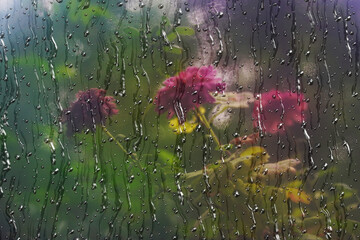 Water droplets- streaks and raindrops on the glass