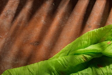 Napkin on an orange background. Magic stage lighting on an abstract backdrop