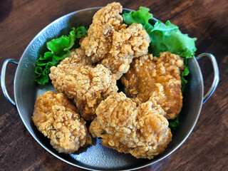 Crispy Fried Chicken Pieces with Lettuce Garnish