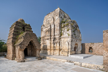 Fototapeta premium Morning landscape view of ancient stone temples at Katas Raj hindu Shiva temple complex, Chakwal, Punjab, Pakistan