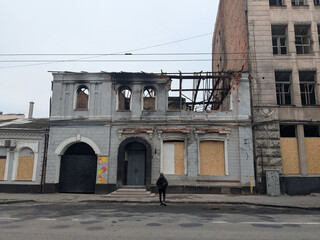 A house with collapsed walls, destroyed by rocket fire