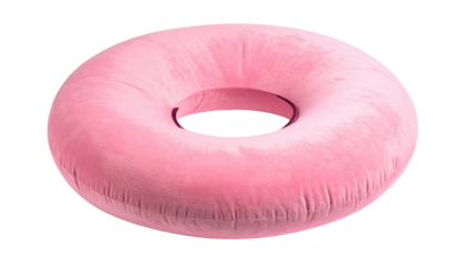 A round, soft pink pillow with a central hole, set against a dark background, featuring subtle shading and soft texture