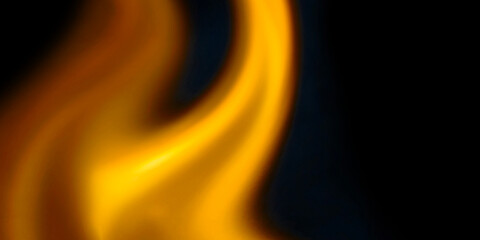 Abstract blurred fire flames in vibrant orange and white glowing against solid black background. High-contrast bokeh effect creating warm energetic and artistic atmospheric texture