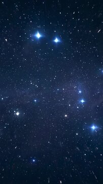 Vertical video: Showing night sky with stars as meteors entering and leaving streaks, faint nebula