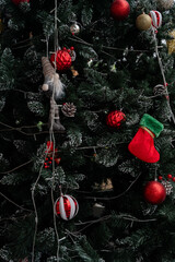 Christmas tree Decorations: A vibrant, festively decorated Christmas tree, adorned with a variety of colorful ornaments.