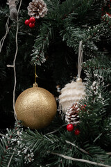 Festive Ornaments on a Christmas Tree: Festive close-up of a decorated Christmas tree. The image is filled with detailed textures and vibrant colors of the holiday season.