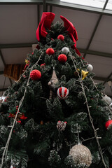 Festive Christmas Tree Decoration: A decorated Christmas tree adorned with ornaments and glowing lights, standing tall and proud, captures the essence of the holiday season.