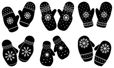 Black and white knitted mittens with snowflake patterns on white background winter