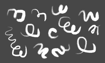 Collection of hand drawn abstract white squiggles and wavy lines on a dark gray background