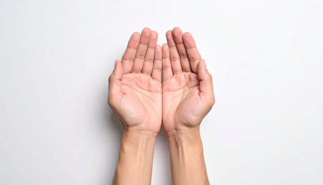 Top-down view of two open human hands cupped together on a white background palms