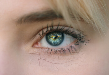 Woman with cracked on face as cosmetic and dehydration effect concept.