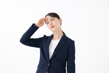 疲れた表情のビジネスウーマン