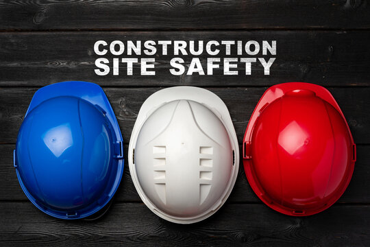 Safety helmets displayed for construction site safety awareness and protection measures - Powered by Adobe