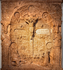 SALZBURG, AUSTIRA - SEPTEMBER 8 2025: The stone relief of Baptism of Christ in the chapel Margarethenkapelle in the St. Peter Abtei cemetery by unknown artist from end of 16. cent. 