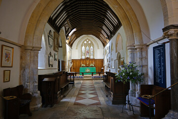 Fototapeta premium View Down the Nave Aisle to the Altar and Chancel of St Thomas à Becket Church