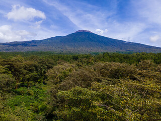 Obraz premium Aerial View of Slamet Mountain with Forest Below Its Slope (Central Java, Indonesia)