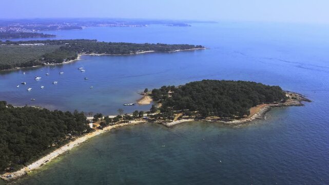 Aerial view of charming tourist town of Porc, Croatia, with historic buildings and coastal scenery. Perfect for travel, tourism, vacation,  Mediterranean lifestyle concepts.