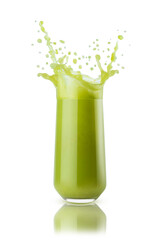 Fresh green vegetable juice - bright flying drops, splashes in glass isolated on background. Healthy vegetarian drink for detox diet menu, fitness food advertising, organic cuisine or restaurant.