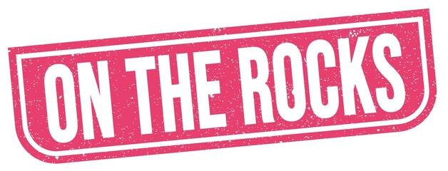 ON THE ROCKS text written on pink stamp sign.