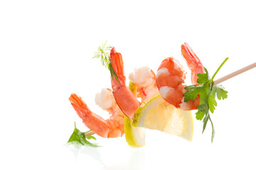 Boiled red shrimps with lemon on white background