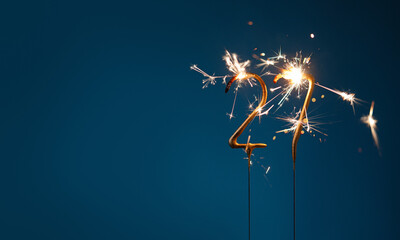 27 years celebration festive background with copy space made with Bengal fires in the form of number Twenty seven.