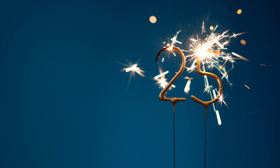25 years anniversary celebration festive background with copy space made with Bengal fires in the...