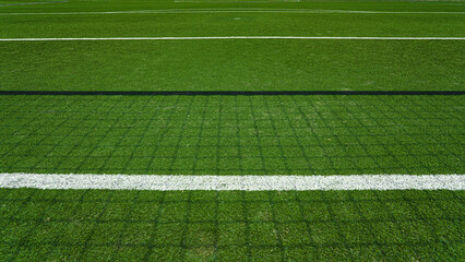 Obraz premium textured soccer game field - shadows from the soccer net