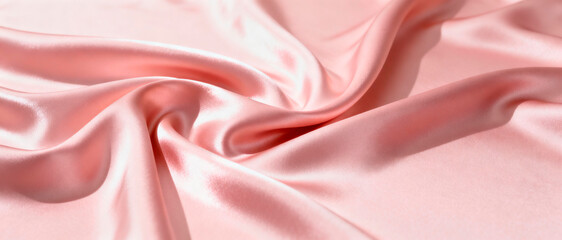 Ultra-wide 4:1 shot of softly folded blush-pink silk fabric creating elegant waves and highlights, luxurious romantic texture, no objects. Soft studio lighting with gentle shadows. High-end editorial 