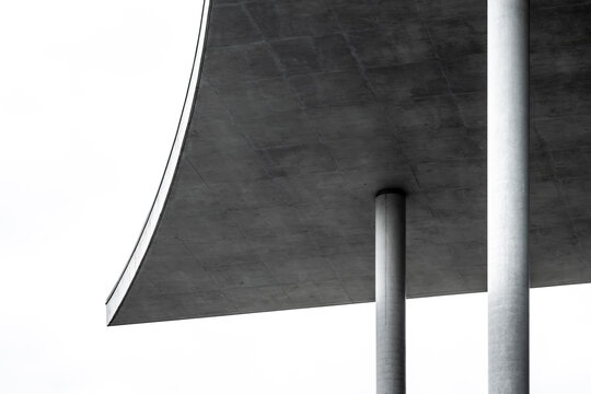 Urban architecture detail with concrete columns and modern geometric structure, abstract minimalism emphasizing exterior architectural composition