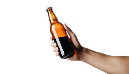 A hand holds a full brown glass beer bottle with a metal cap isolated against a white background, representing a cold alcoholic beverage or lager refreshment for a celebration