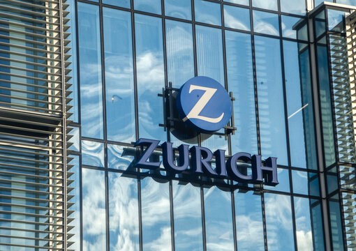Glass building facade in dublin with the "Zurich" logo prominently displayed.