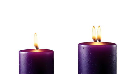 Three glowing candles with bright yellow flames burn against a black background, creating a warm candlelight glow for a holiday celebration or religious Christmas decoration in the dark night