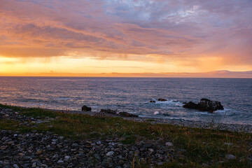 Russia, Murmansk region, Rybachy Peninsula. Sunset on the Barents Sea coast. August 2025