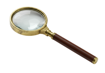 A vintage magnifying glass with an aged brass frame and mahogany handle on a transparent background with copy space. Concept of detailed focus and craftsmanship.