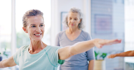 Obraz premium Mature woman, coaching and stretching with yoga class for spiritual wellness or balance together. Senior people, yogi and fitness in warriors pose for warm up, mindfulness or retirement exercise